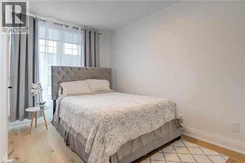 Bedroom featuring light wood-style floors and baseboards - 151C Port Robinson Road, Pelham, ON - Indoor Photo Showing Bedroom