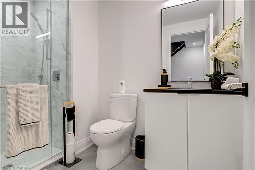 Bathroom with a shower stall, vanity, baseboards, and toilet - 151C Port Robinson Road, Pelham, ON - Indoor Photo Showing Bathroom