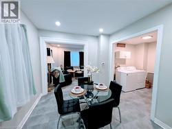 Dining room with recessed lighting and vinyl floors - 