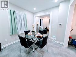 Dining room with recessed lighting and vinyl floors - 