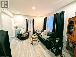 Living room with recessed lighting and vinyl floors - 