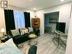 Living room with recessed lighting and vinyl floors - 