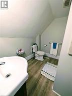 Bathroom with and dark wood finished floors - 