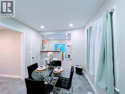 Dining room with recessed lighting and vinyl floors - 