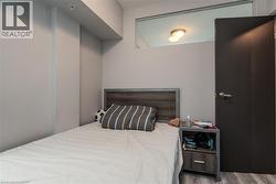 Bedroom featuring wood finished floors - 