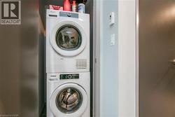Laundry area featuring stacked washer / drying machine - 