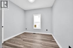 Empty room featuring light wood-style floors and baseboards - 