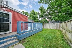 Fenced backyard featuring a deck - 