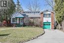 View of front of home with a front lawn, asphalt driveway, a garage, brick siding, and a chimney - 9 Daleview Court, Hamilton, ON  - Outdoor 