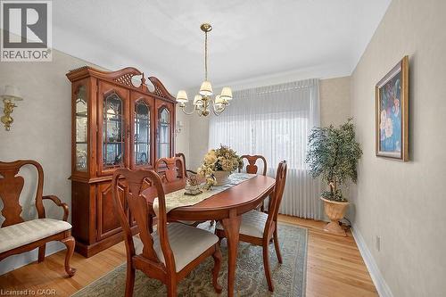 Dining room with light wood finished floors and a chandelier - 9 Daleview Court, Hamilton, ON - Indoor Photo Showing Dining Room