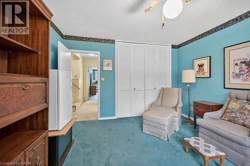 Sitting room featuring dark carpet and ceiling fan - 9 Daleview Court, Hamilton, ON - Indoor