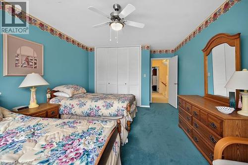 Bedroom featuring dark carpet, ceiling fan, and a closet - 9 Daleview Court, Hamilton, ON - Indoor Photo Showing Bedroom