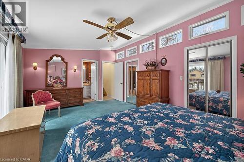 Bedroom with a closet, carpet, ceiling fan, and crown molding - 9 Daleview Court, Hamilton, ON - Indoor Photo Showing Bedroom