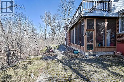 View of side of home with a sunroom and brick siding - 9 Daleview Court, Hamilton, ON - Outdoor With Balcony