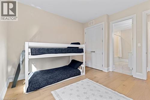 Bedroom with baseboards, visible vents, and wood finished floors - 308 Appleby Line, Burlington, ON - Indoor Photo Showing Bedroom
