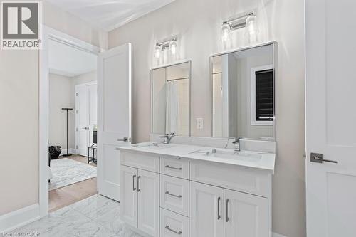 Full bathroom with double vanity, marble finish floor, baseboards, and a sink - 308 Appleby Line, Burlington, ON - Indoor Photo Showing Bathroom
