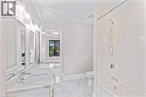 Bathroom with toilet, shower / washtub combination, marble finish floor, and a sink - 308 Appleby Line, Burlington, ON - Indoor Photo Showing Bathroom