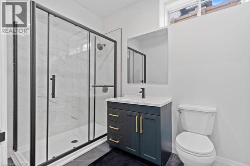 Full bathroom featuring vanity, toilet, a marble finish shower, and baseboards - 308 Appleby Line, Burlington, ON - Indoor Photo Showing Bathroom