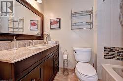 Full bathroom with toilet and vanity - 