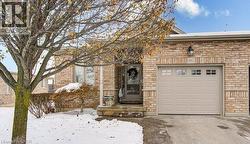 View of front facade featuring stone siding and brick siding - 