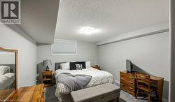 Carpeted bedroom featuring a textured ceiling - 