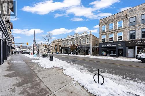 View of asphalt road featuring sidewalks, street lights, and traffic lights - 26 Main Street, Cambridge, ON 