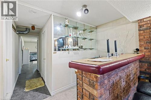 Indoor bar with a textured ceiling and carpet - 490 Queen Victoria Drive, Hamilton, ON - Indoor Photo Showing Other Room