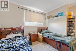 Bedroom featuring light carpet - 