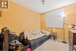 Living room featuring a textured ceiling and carpet floors - 
