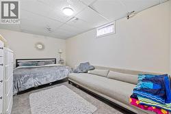 Bedroom with a drop ceiling and carpet - 