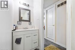 Half bath with vanity and baseboards - 