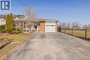 Single story home featuring driveway, brick siding, a porch, and a garage - 490 Queen Victoria Drive, Hamilton, ON  - Outdoor 