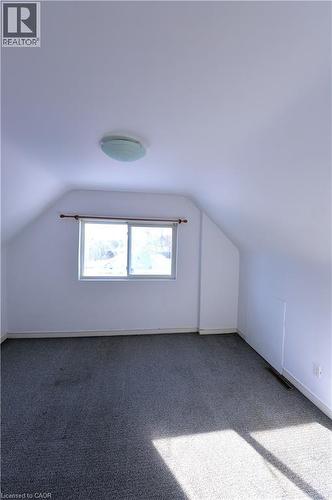 Bonus room with lofted ceiling and carpet flooring - 1448 Upper Ottawa Street, Hamilton, ON - Indoor Photo Showing Other Room