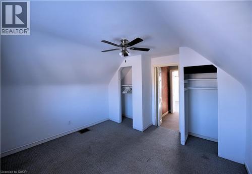Bonus room featuring lofted ceiling, dark carpet, and ceiling fan - 1448 Upper Ottawa Street, Hamilton, ON - Indoor Photo Showing Other Room