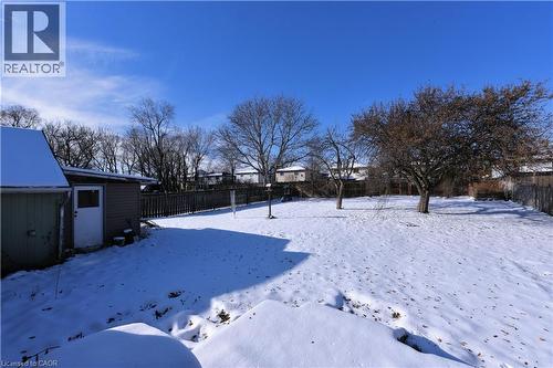 Yard covered in snow featuring volleyball court - 1448 Upper Ottawa Street, Hamilton, ON - Outdoor