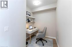 Office featuring baseboards and light wood-style flooring - 