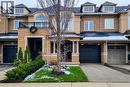 Craftsman-style home with a garage, a balcony, driveway, and stone siding - 3362 Whilabout Terrace, Oakville, ON  - Outdoor With Facade 