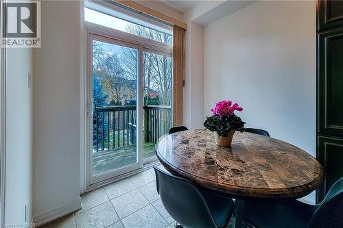 Dining area featuring light tile patterned floors - 3362 Whilabout Terrace, Oakville, ON - Indoor