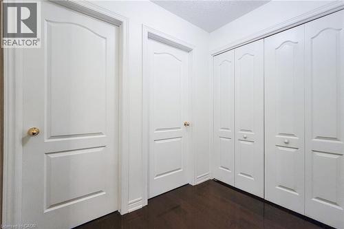 View 2nd and 3rd bedroom and double doors to laundry from top of stairs - 3362 Whilabout Terrace, Oakville, ON - Indoor Photo Showing Other Room