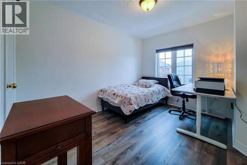 Bedroom featuring a desk, wood finished floors, and a textured ceiling - 3362 Whilabout Terrace, Oakville, ON - Indoor Photo Showing Bedroom