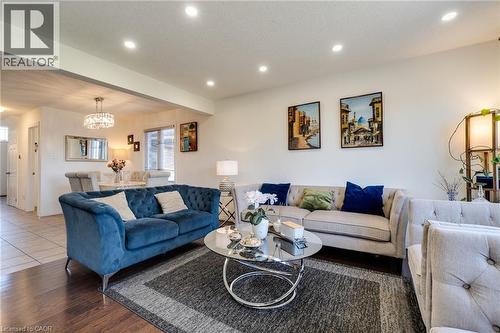 Living room with recessed lighting, a chandelier, a textured ceiling, and wood finished floors - 928 Dunblane Court, Kitchener, ON - Indoor Photo Showing Living Room