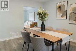 Dining space featuring baseboards and wood finished floors - 