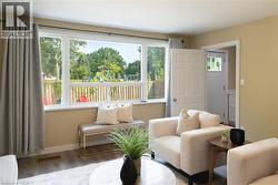 Living room with wood finished floors and baseboards - 