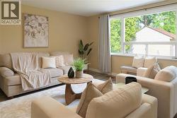 Living room with baseboards and wood finished floors - 