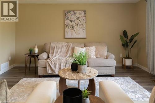 Living room featuring wood finished floors and baseboards - 39 Cloverhill Road, Hamilton, ON - Indoor Photo Showing Living Room