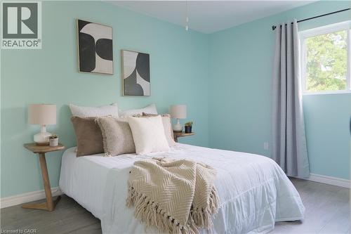 Bedroom featuring baseboards and wood finished floors - 39 Cloverhill Road, Hamilton, ON - Indoor Photo Showing Bedroom
