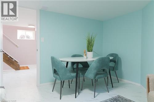 Dining space with stairs and marble look tile flooring - 39 Cloverhill Road, Hamilton, ON - Indoor