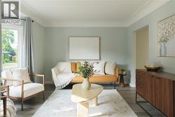 Living area with baseboards and dark wood-style flooring - 