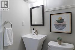 Half bathroom featuring toilet and a sink - 