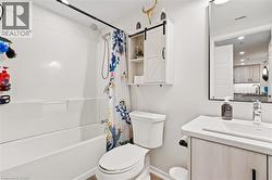 Full bath with shower / tub combo with curtain, vanity, and recessed lighting - 